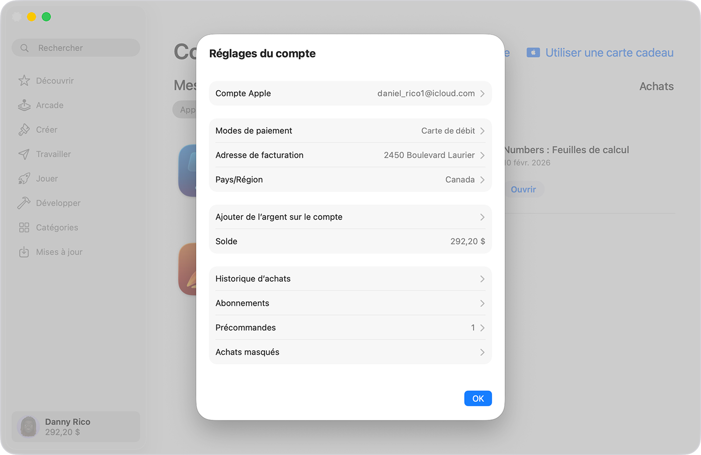 Un Mac montrant l’écran Réglages du compte sur l’App Store sur macOS Tahoe 26. Pour ajouter de l’argent à votre compte Apple, cliquez sur Ajouter de l’argent au compte.